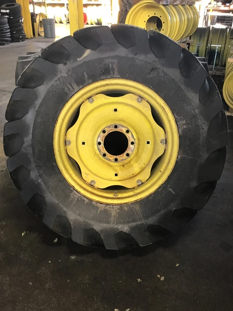 Used 18.4-28 12 ply Firestone All Traction Utility TL R-4 50-55% on 15 X 28 8-8-6 Titan 6 Clamp