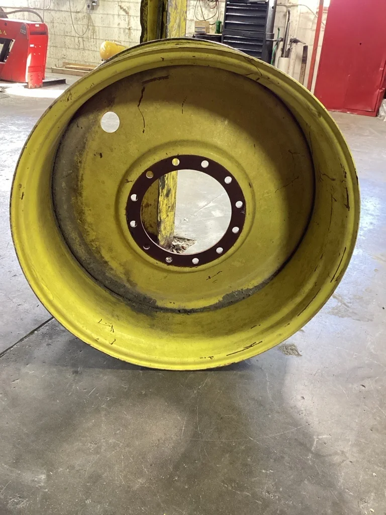 Used 18 x 38 12-13.976-11.857-1 Solid Yellow Wheel
