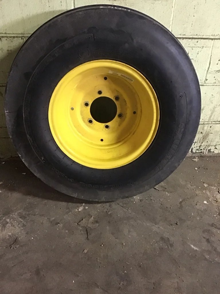 Used 11L-15/8 Alliance Multi Rib Front 313 TL F-2M 90-95% on 8 X 15 6-6-4.62 Solid Yellow Wheel