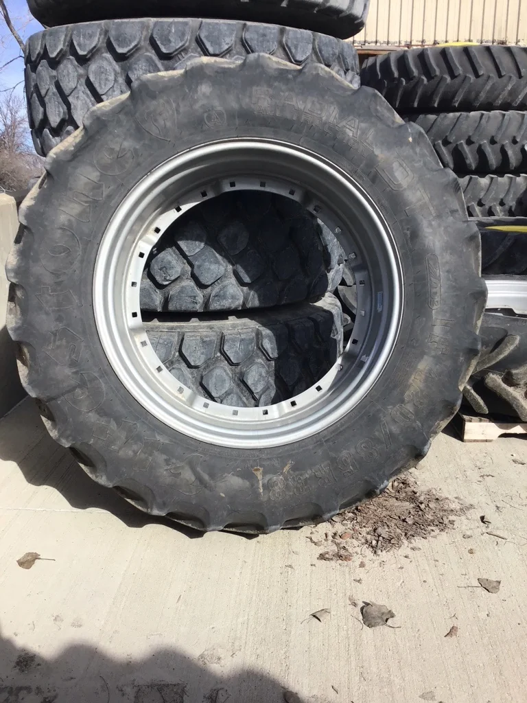 Used IF420/85R38 153B Firestone RAD DT TL R-1W 60-65% on 15 X 38 14-33.25 3 Bolt Waffle Silver