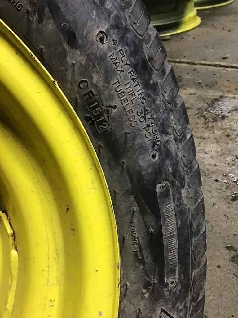 Used 27x10.50-15/4 Titan Multi Trac C/S TL R-3 65-70% on 8 x 15 6-6-4.62 Implement Yellow Wheel image 3