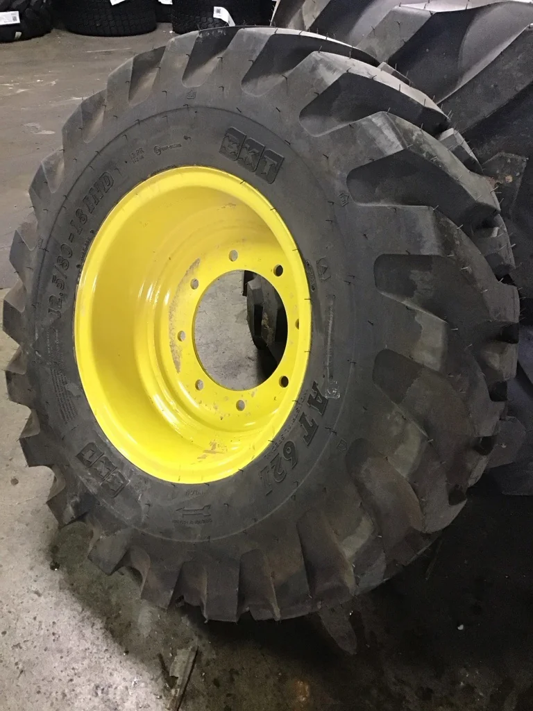 Take-Off 12.5/80-12 BKT AT621 TL R-4 95-100% on 9 X 18 8-10.82-8.78 GKN Solid Yellow Wheel(Assembly) image 2
