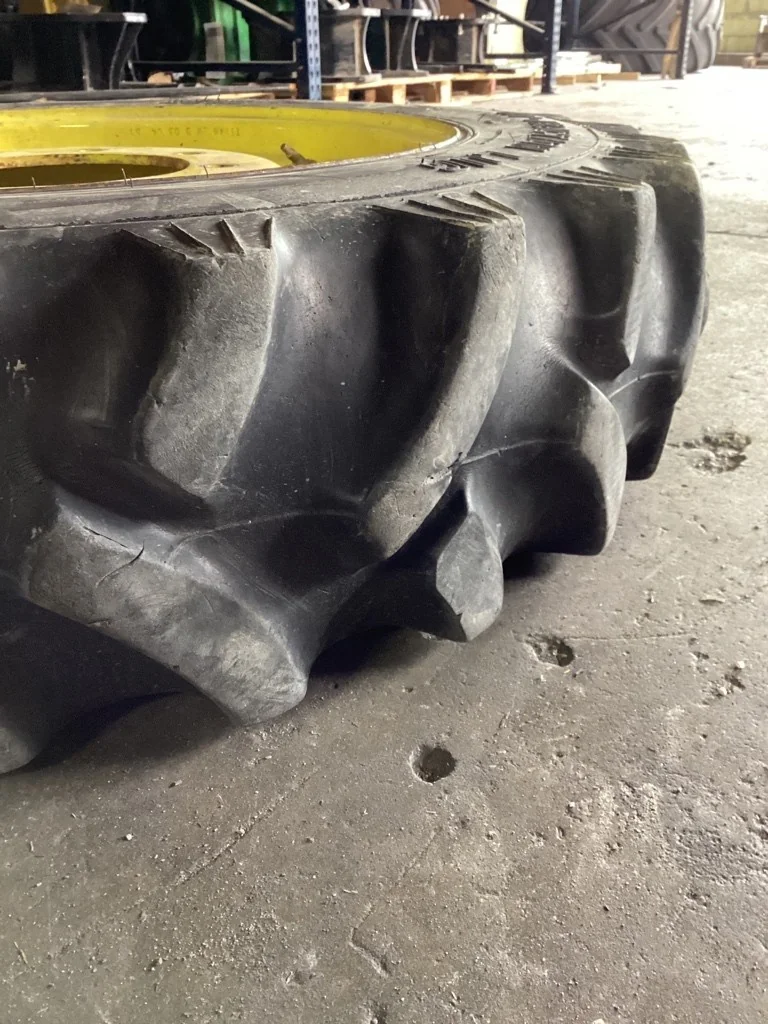 Used 9.5-24 6 ply Titan Hi-Traction Lug TL R-1 50-55% on 8 x 24 6 Clamp Wheel & Disc (8-10.82-8.78) image 2