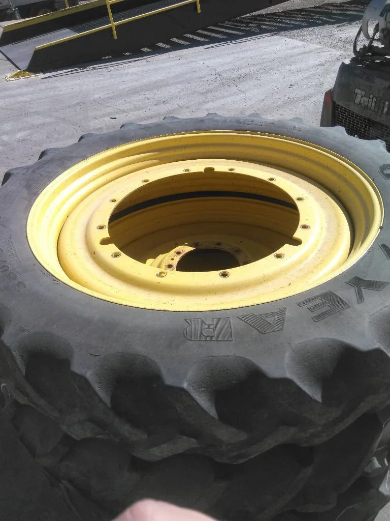 Used 12 x 50 Titan (12-32.047-30.078) John Deere Rim & Rail  ( Mild Rust Pain Fair)
