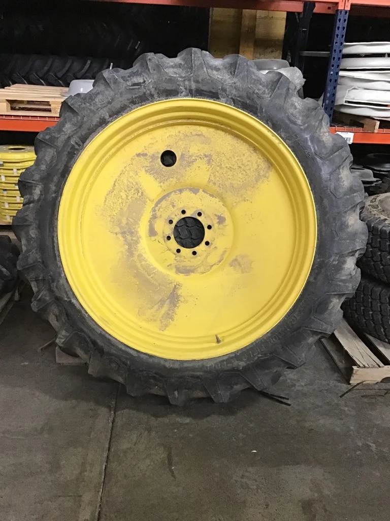 Used 12.4-42/10 Firestone Traction Field & Road TL R-1 80-85% on 10 X 42 GKN 8-8-6.0-8.812FS Yellow