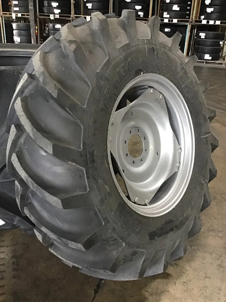 18.4R30 BKT TR136TT Tires 100% on 15 x 30 8-8-5.94 4/2 clamp silver w/ disc
