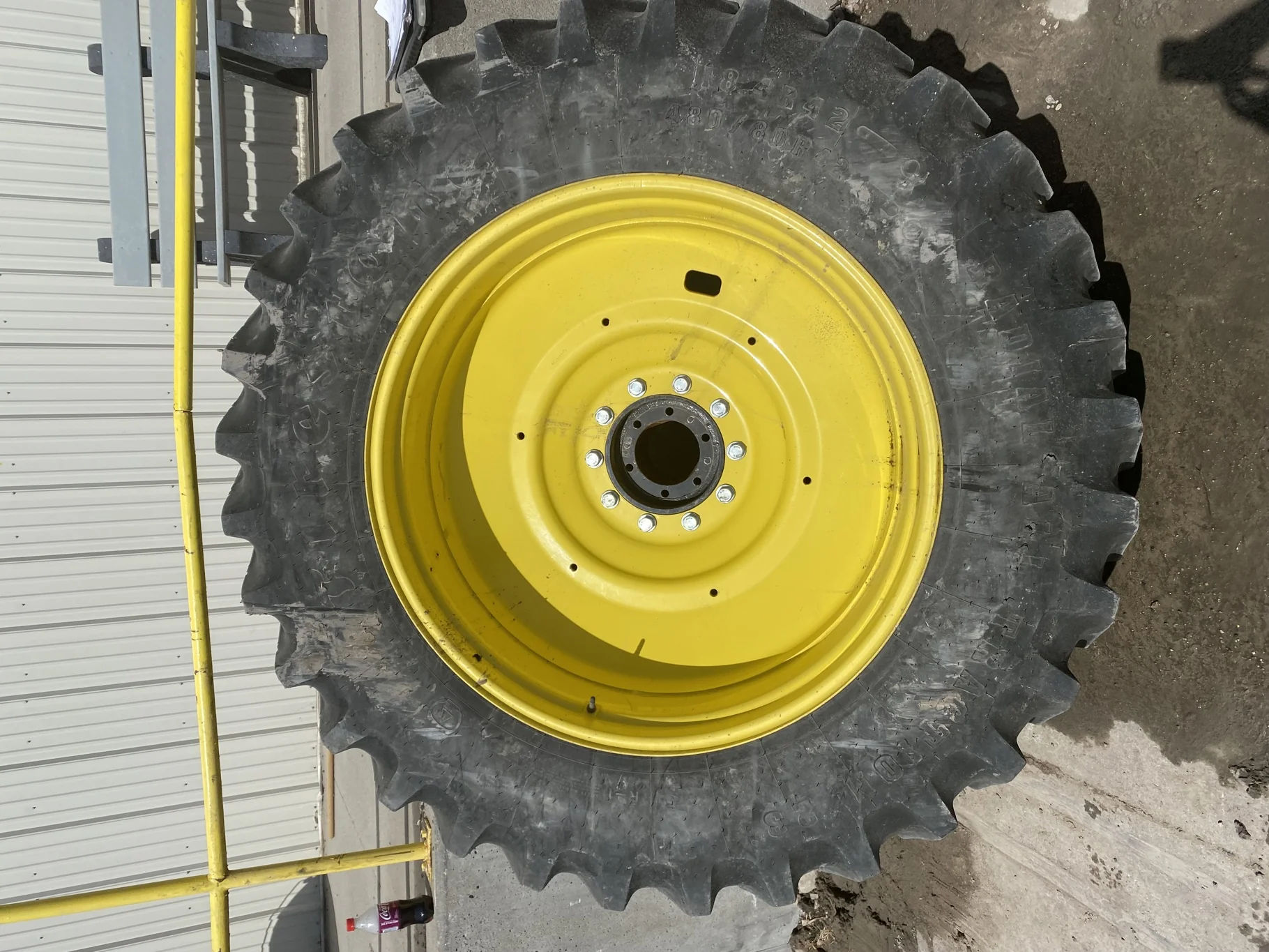 Used 65% 480/80R42 Firestone RadialAll Traction R-1W (151B) TL on a 16 x 42 JD Yellow 10 Bolt
