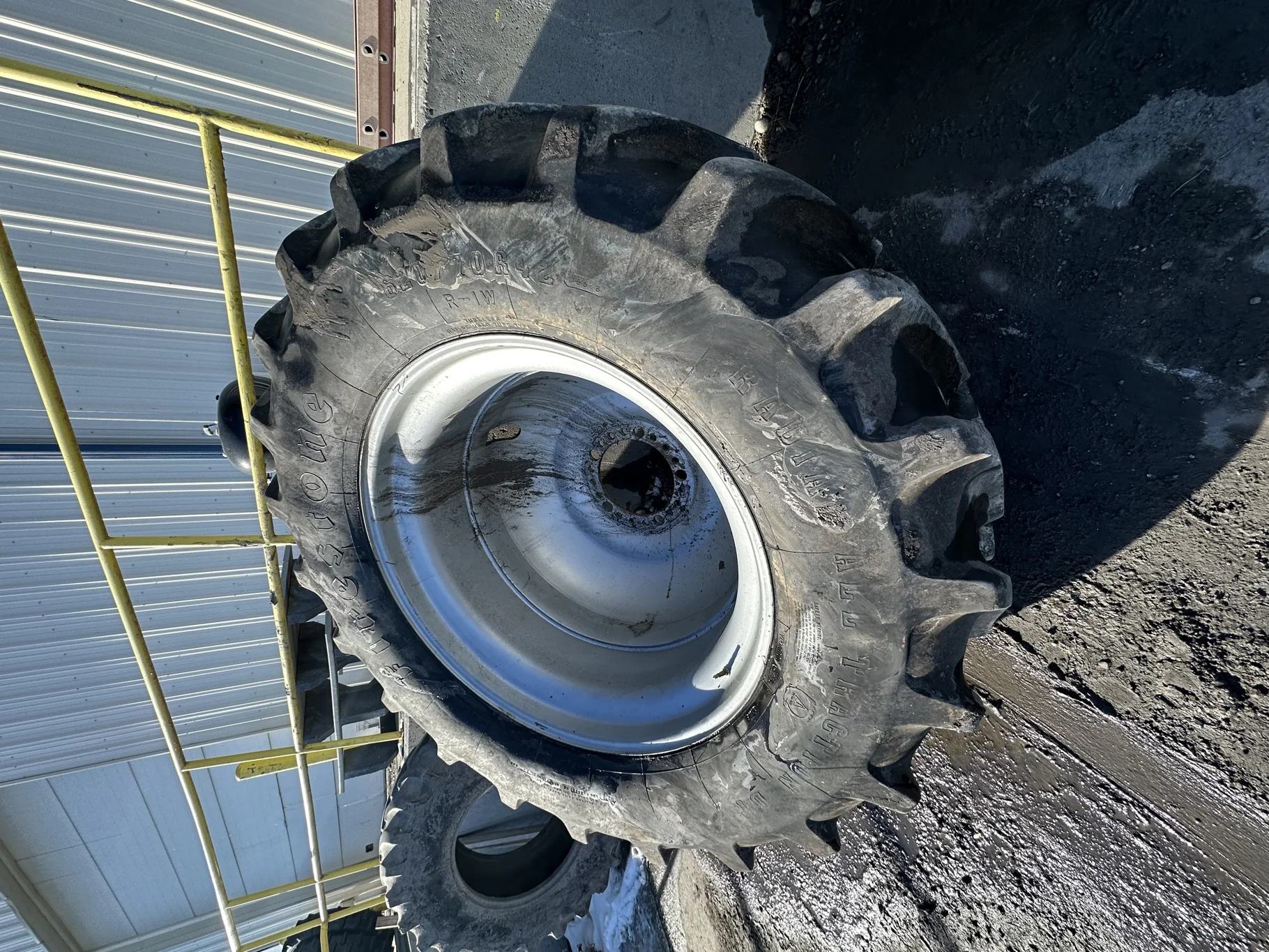 Used 85% 620/70R42 Firestone Radial All Traction Deep Tread R-1W (160B) TL on a 18 x 42 Case Silver