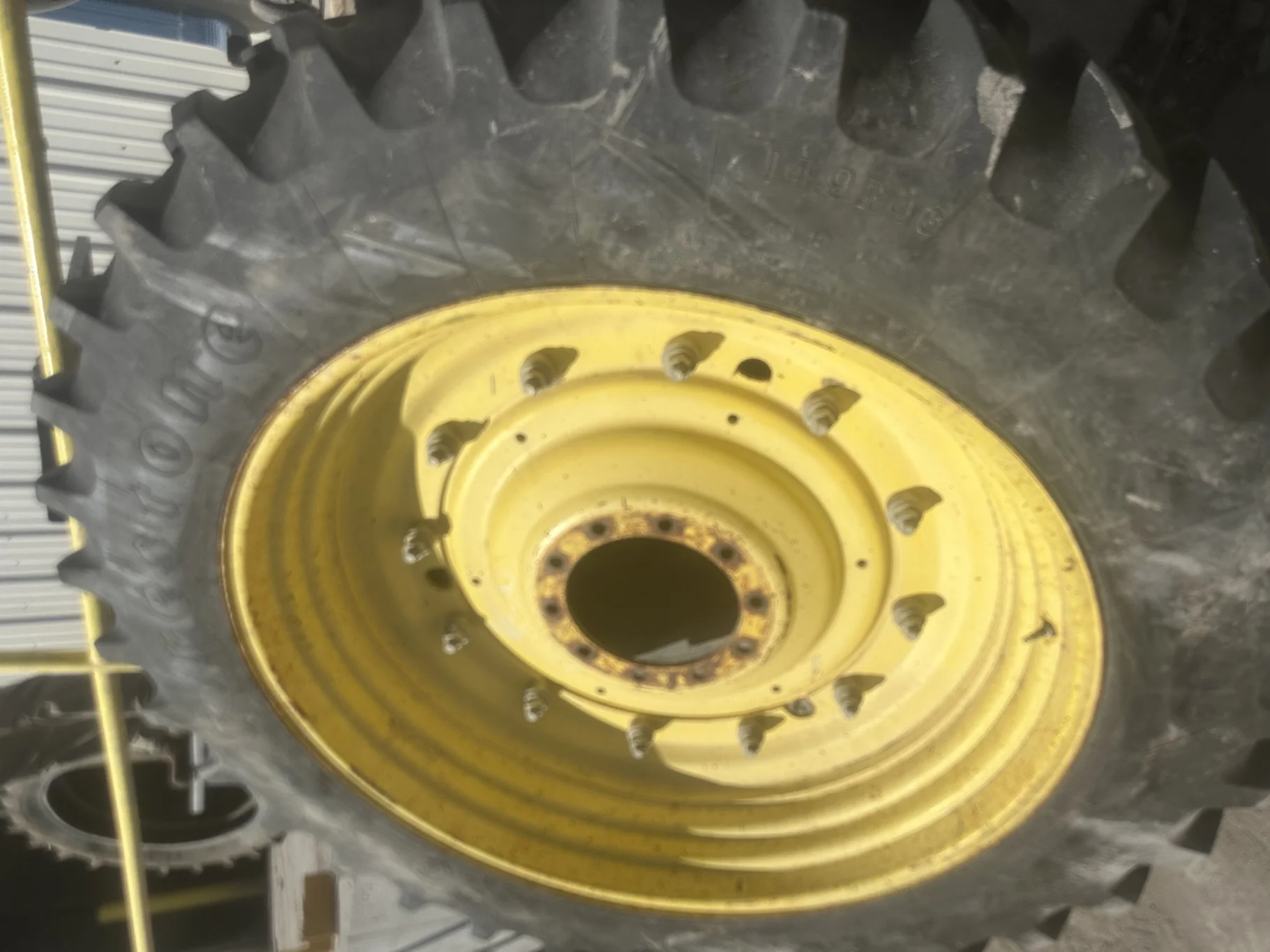 Used 80% 14.9R46 Firestone Radial All Traction 23 mounted on 13 x 46 JD Stub disc Yellow Rim w