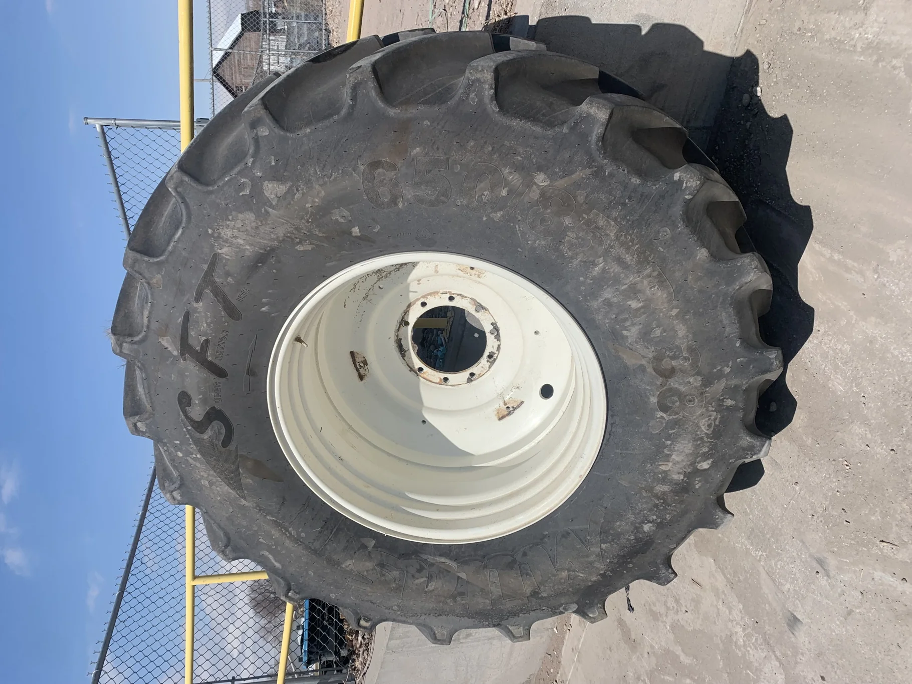 Used 80% 650/85R38 Mitas SFT 173D/176A8 TL on a 20 x 38 JD yellow 10 Hole Wheel (10-13.187-11.41) (L