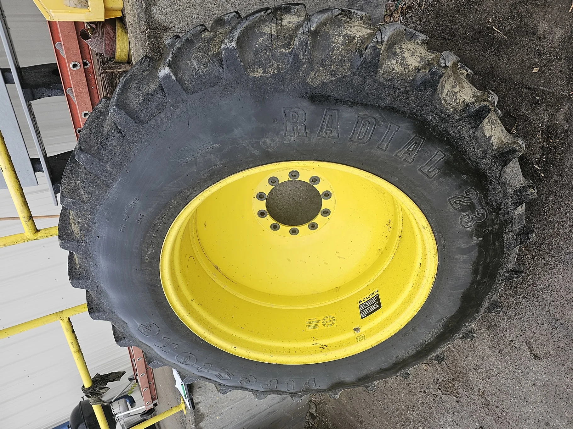 Used 80% 18.4R38 Firestone Radial All Traction 23 R-1 (146A8) TL on a 16 x 38 JD Yellow 10 Bo