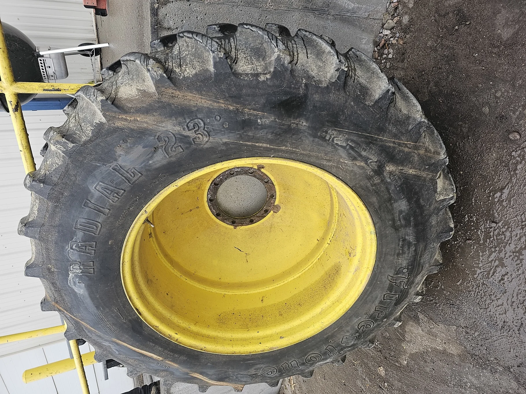 Used 80% 18.4R38 Firestone Radial All Traction 23 146A8 R-1 TL on a 16 x 38 JD Yellow 10 bolt