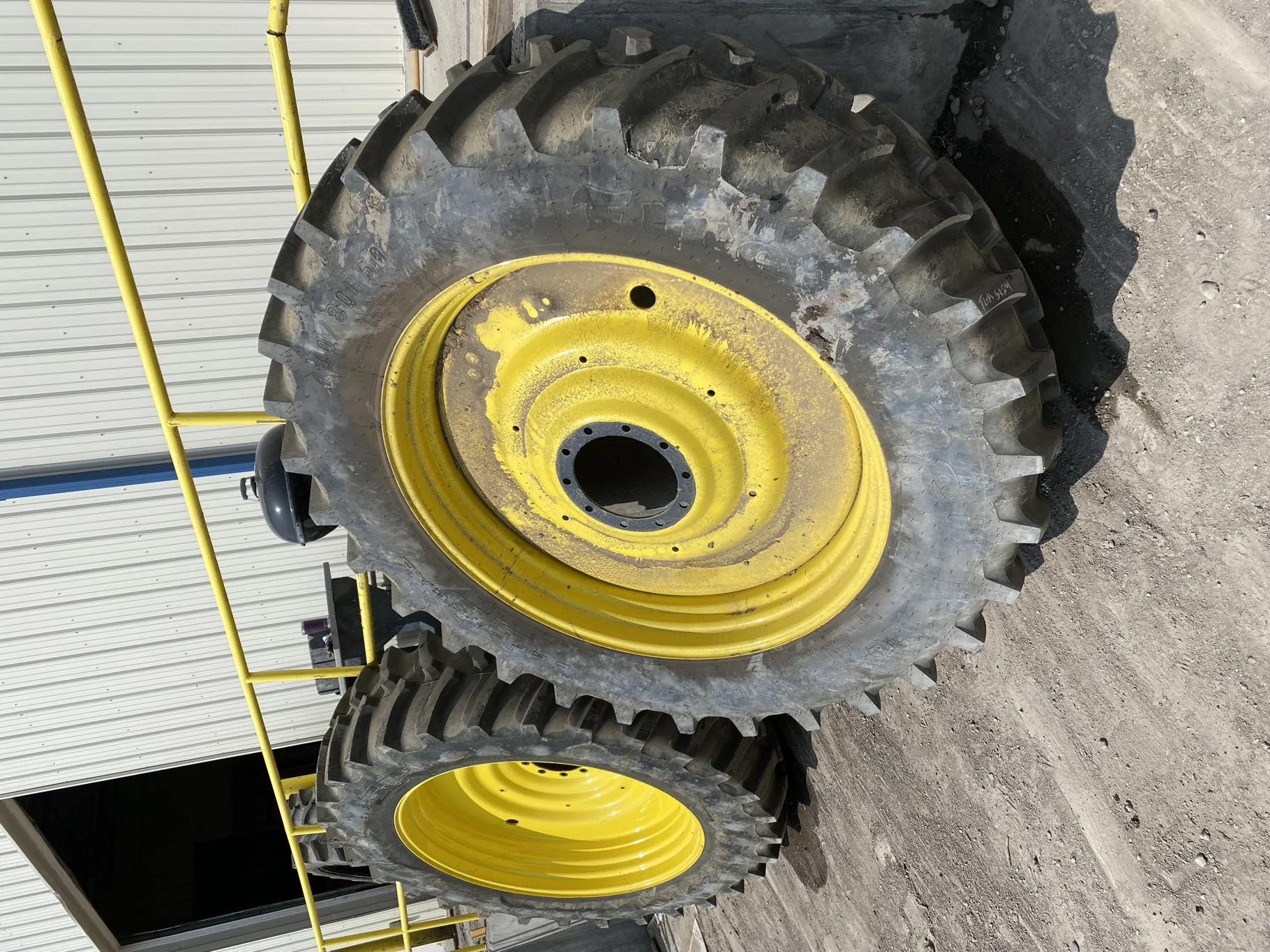 Used 90 480/80R50 Firestone Radial Deep Tread 23 R-1W (159B) TL on a 15 x 50 JD Yellow 10 Bol