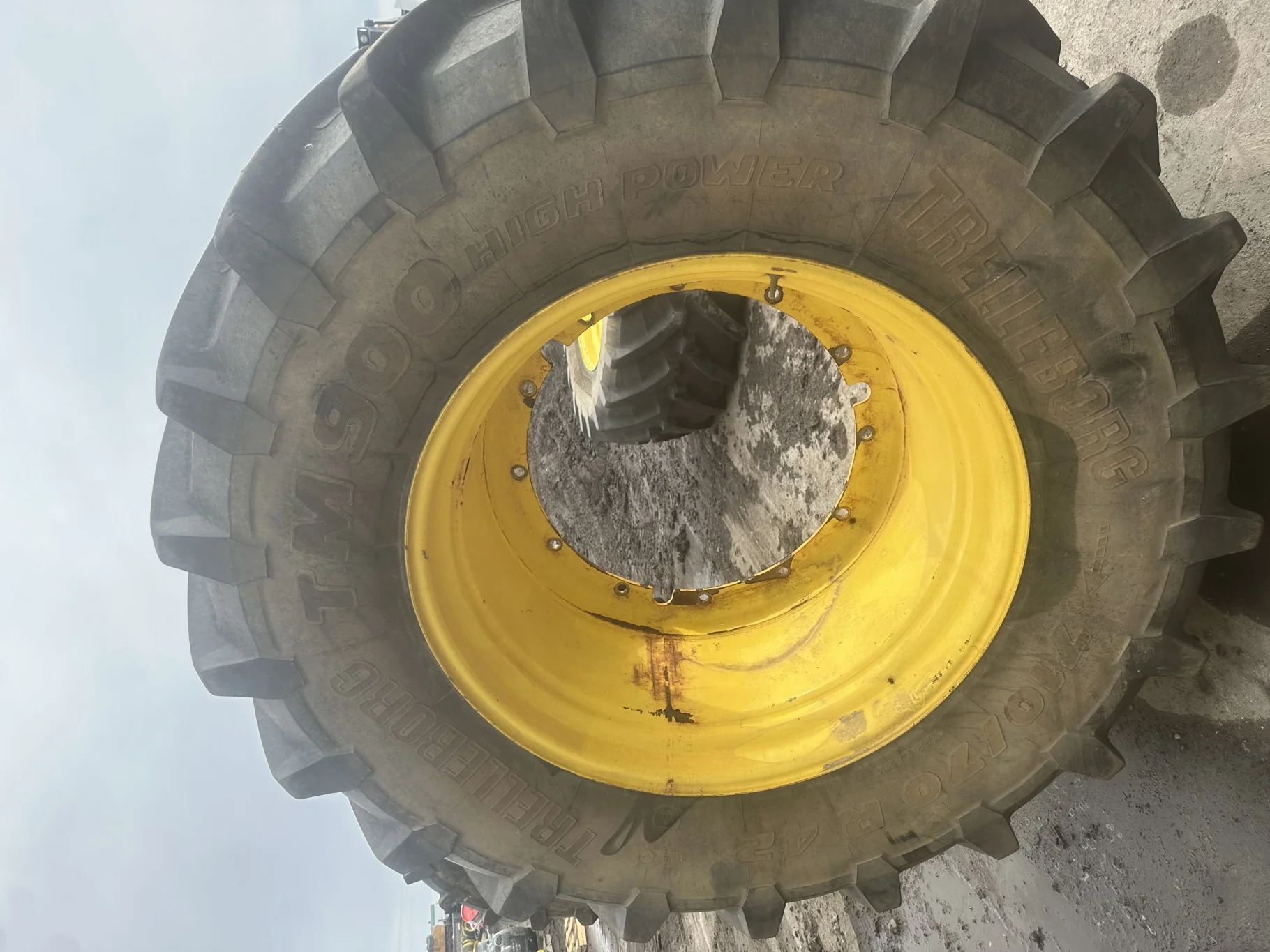 Used 65% 710/70R42 Trelleborg TM900 High Power R-1W (173A8) TL on a 23 x 42 JD Yellow 12 Bolt