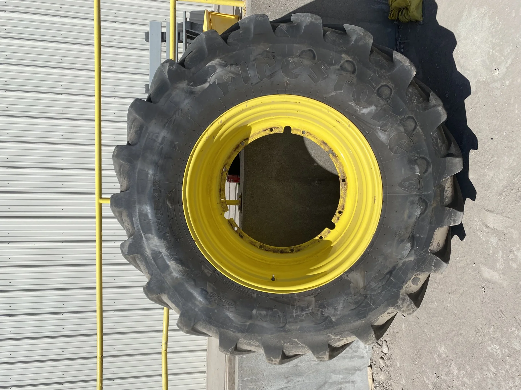 Used 93% IF710/70R42 Firestone Maxi Traction R-1W (179D) TL on a 23 x 42 JD Yellow 12 Bolt (.9