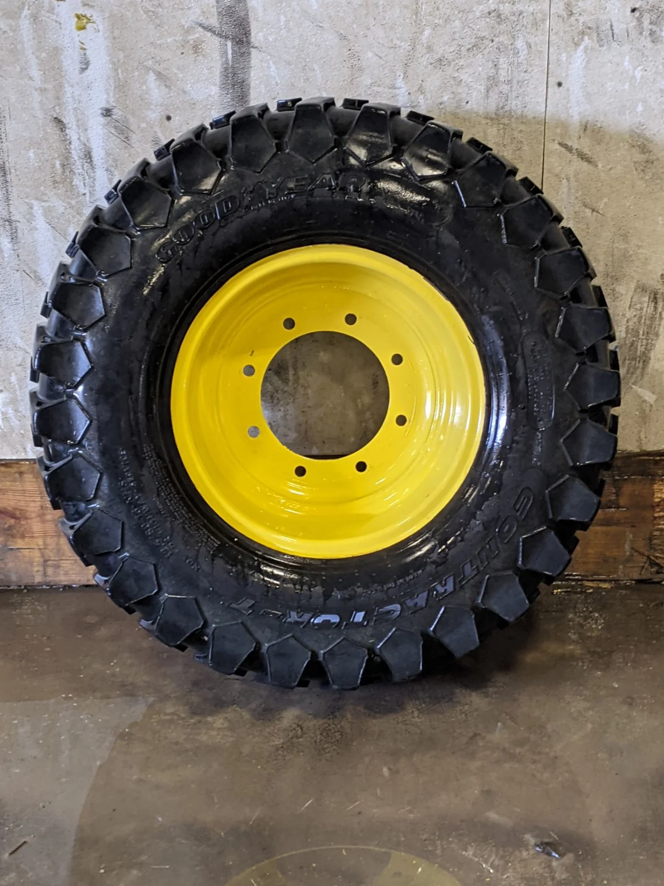 Used 55% 12.5/80-18 Goodyear Contractor T R-4 tire C(6Ply) on a 9 x 18 JD Yellow Straight Plat
