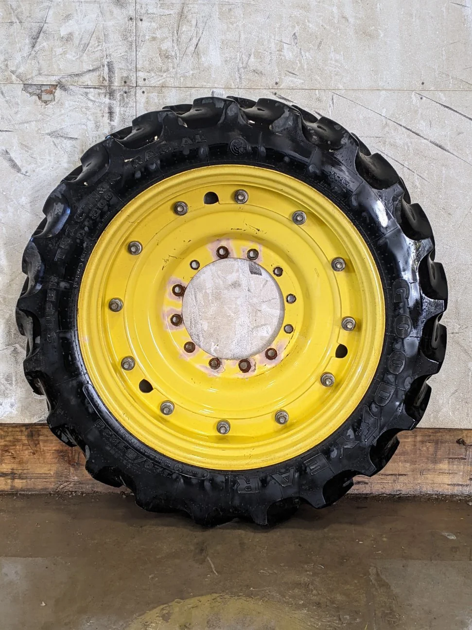 Used 85% 320/85R38 Goodyear Super Traction Radial R-1W (143A8) TL on a 10x38 John Deere Yellow (3) B