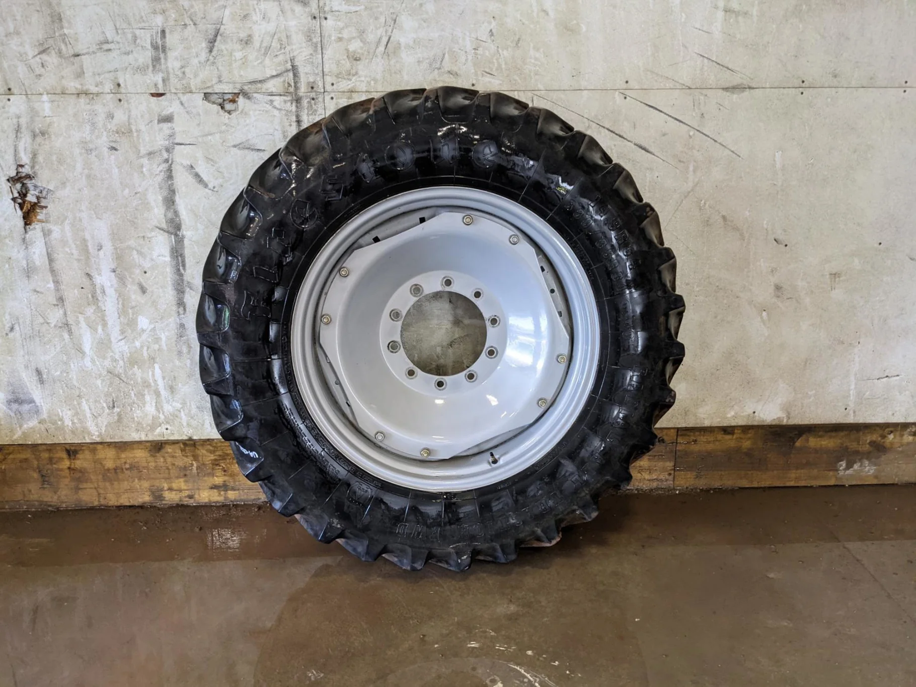 Used 65% 380/85R34 Firestone Radial All Traction FWD R-1 (137A8) TL on a 13 x 34 Agco Waffle Rim w/