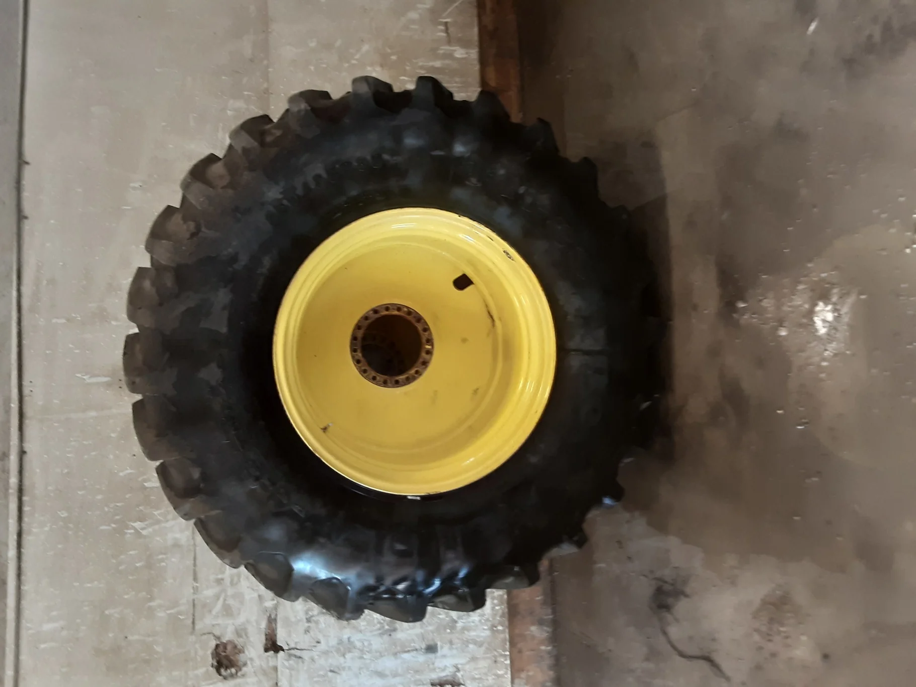 Used 90% 650/85R38 Firestone Radial Deep Tread 23 R-1W (173B) on 23 x 38 John Deere Yellow