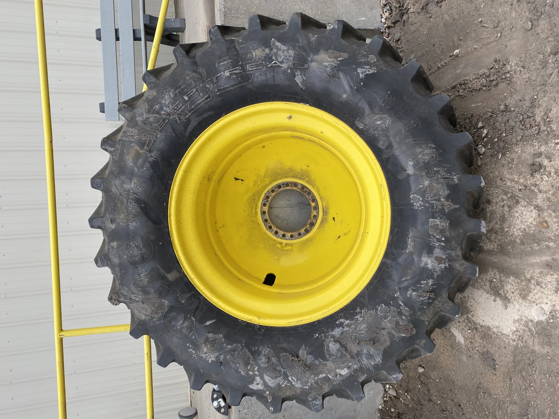 Used 85% 580/85R42 Firestone Radial Deep Tread 23 R-1W (166B) TL on a 18 x 42 JD Yellow 20 B Inside image 2