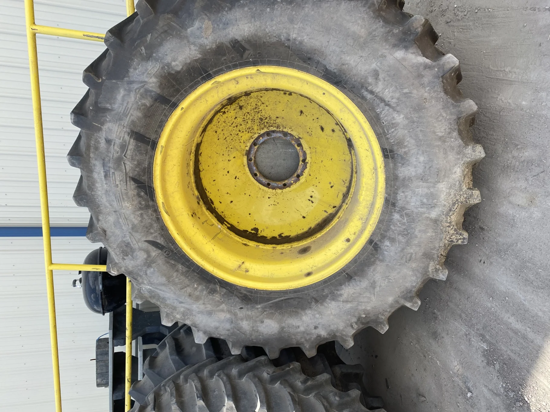 Used 70% 580/85R42 Firestone Radial Deep Tread 23 R-1W (166B) TL on a 18 x 42 JD Yellow 10 Bolt image 2