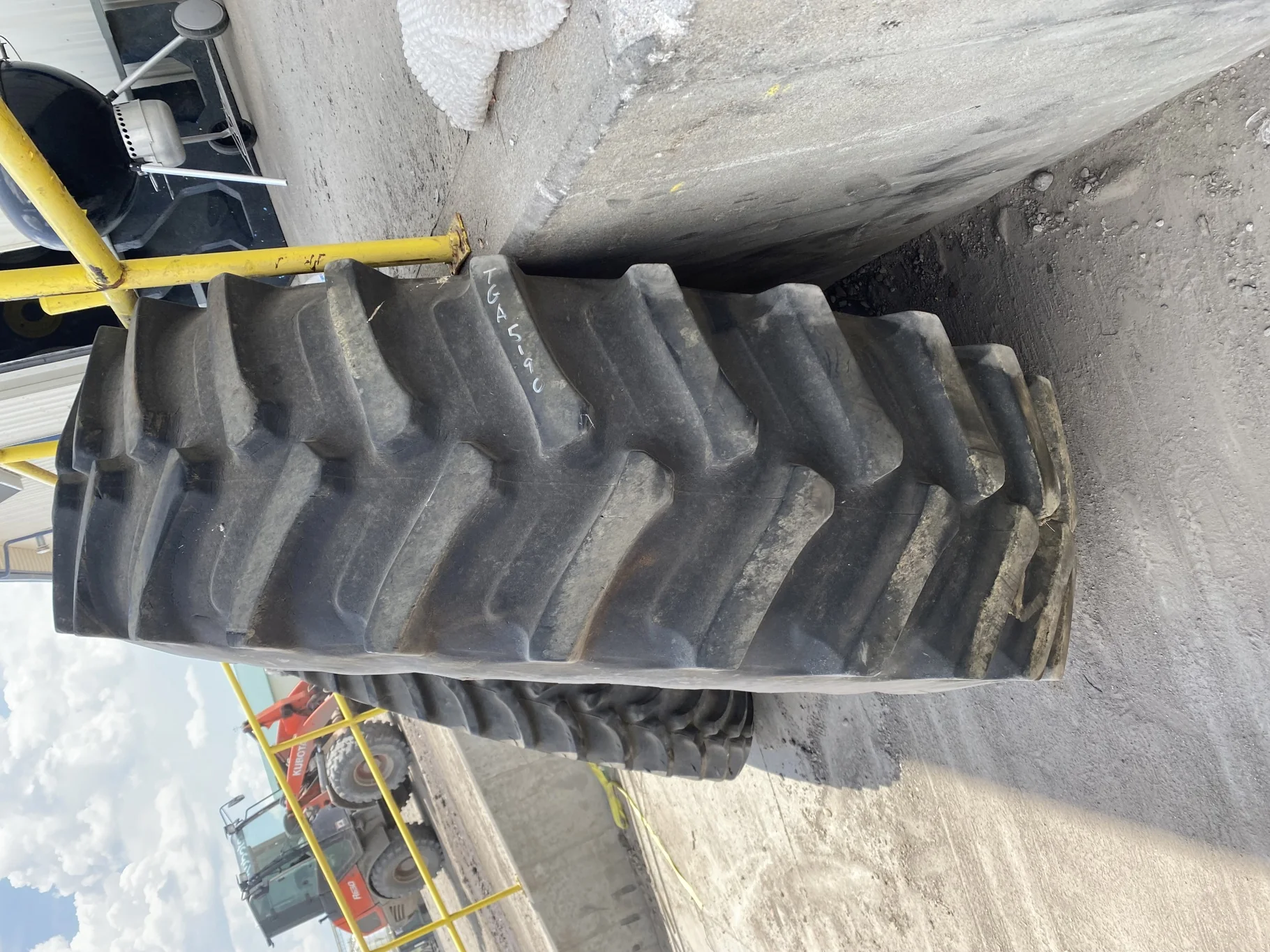 Used 70% 580/85R42 Firestone Radial Deep Tread 23 R-1W (166B) TL on a 18 x 42 JD Yellow 10 Bolt image 3