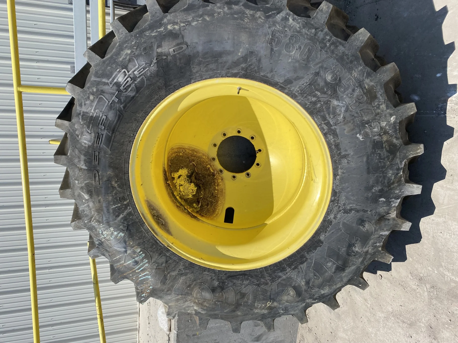 Used 70% 580/85R42 Firestone Radial Deep Tread 23 R-1W (166B )TL on a 18 x 42 JD Yellow 10 Bolt image 2
