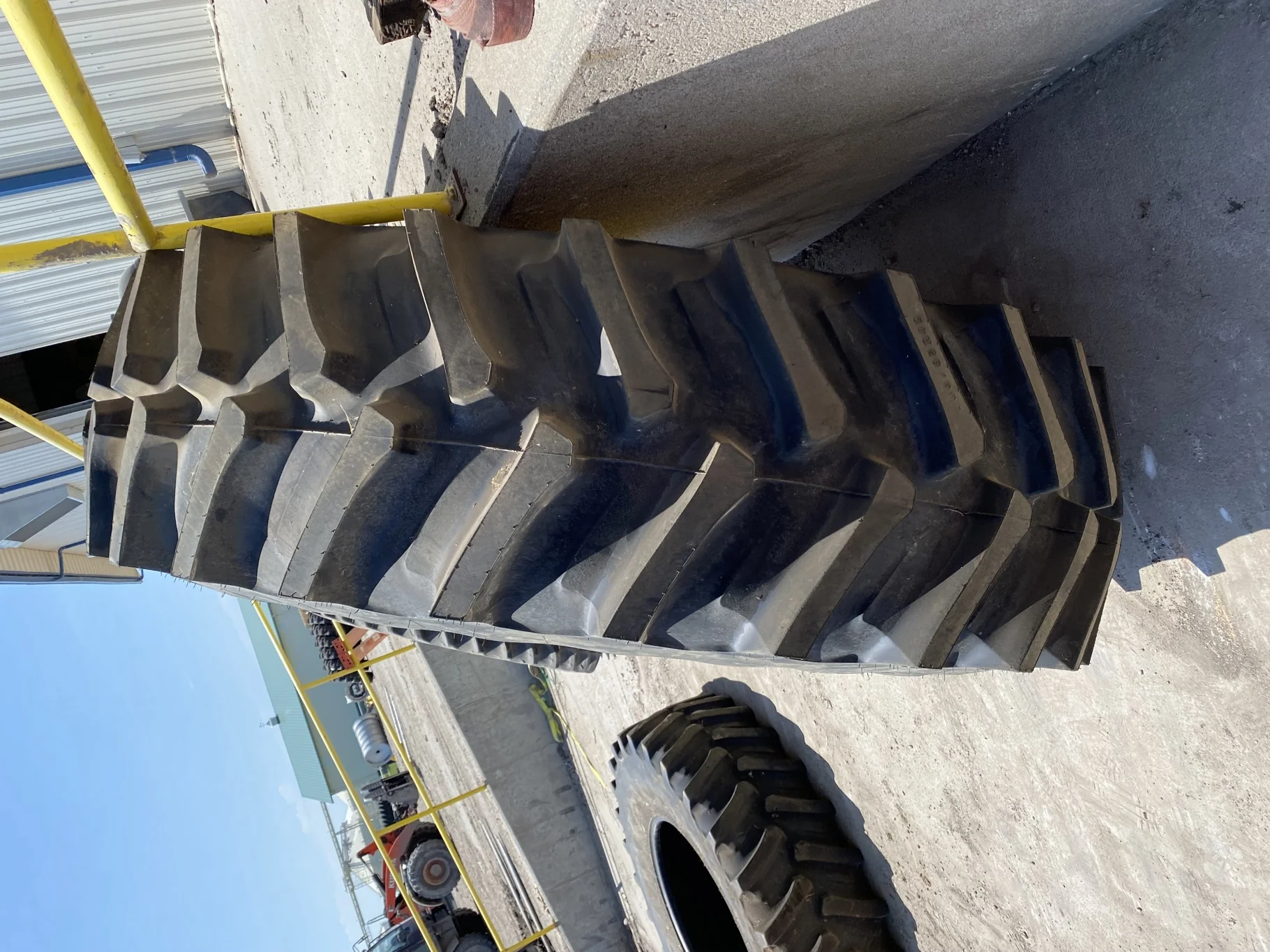 Used 70% 580/85R42 Firestone Radial Deep Tread 23 R-1W (166B )TL on a 18 x 42 JD Yellow 10 Bolt image 3