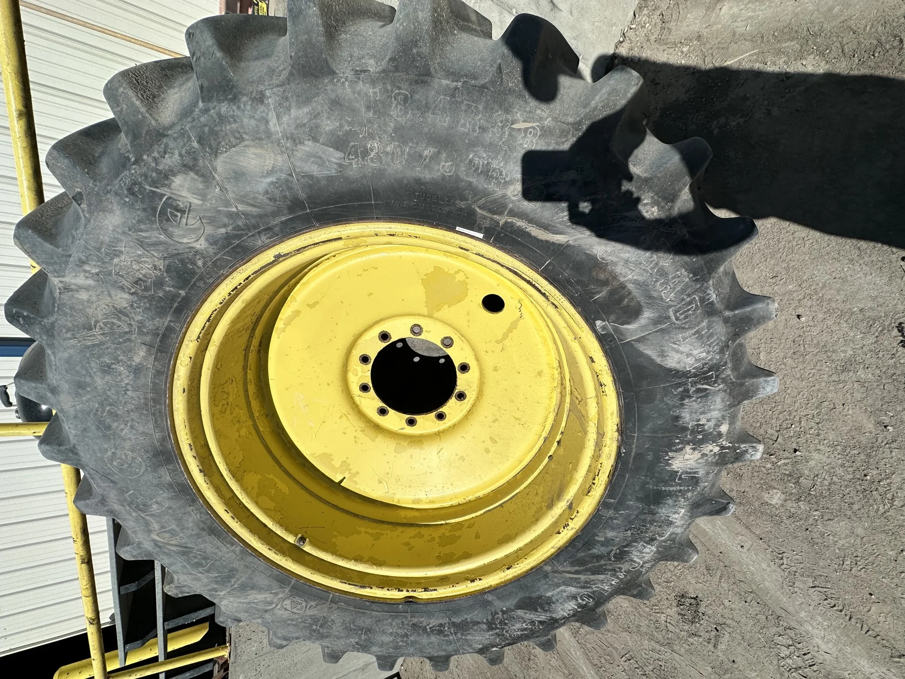 Used 80% 480/80R38 Firestone Radial All Traction 23 R-1 (149B) TL on a 16 x 38 JD Yellow 10 B