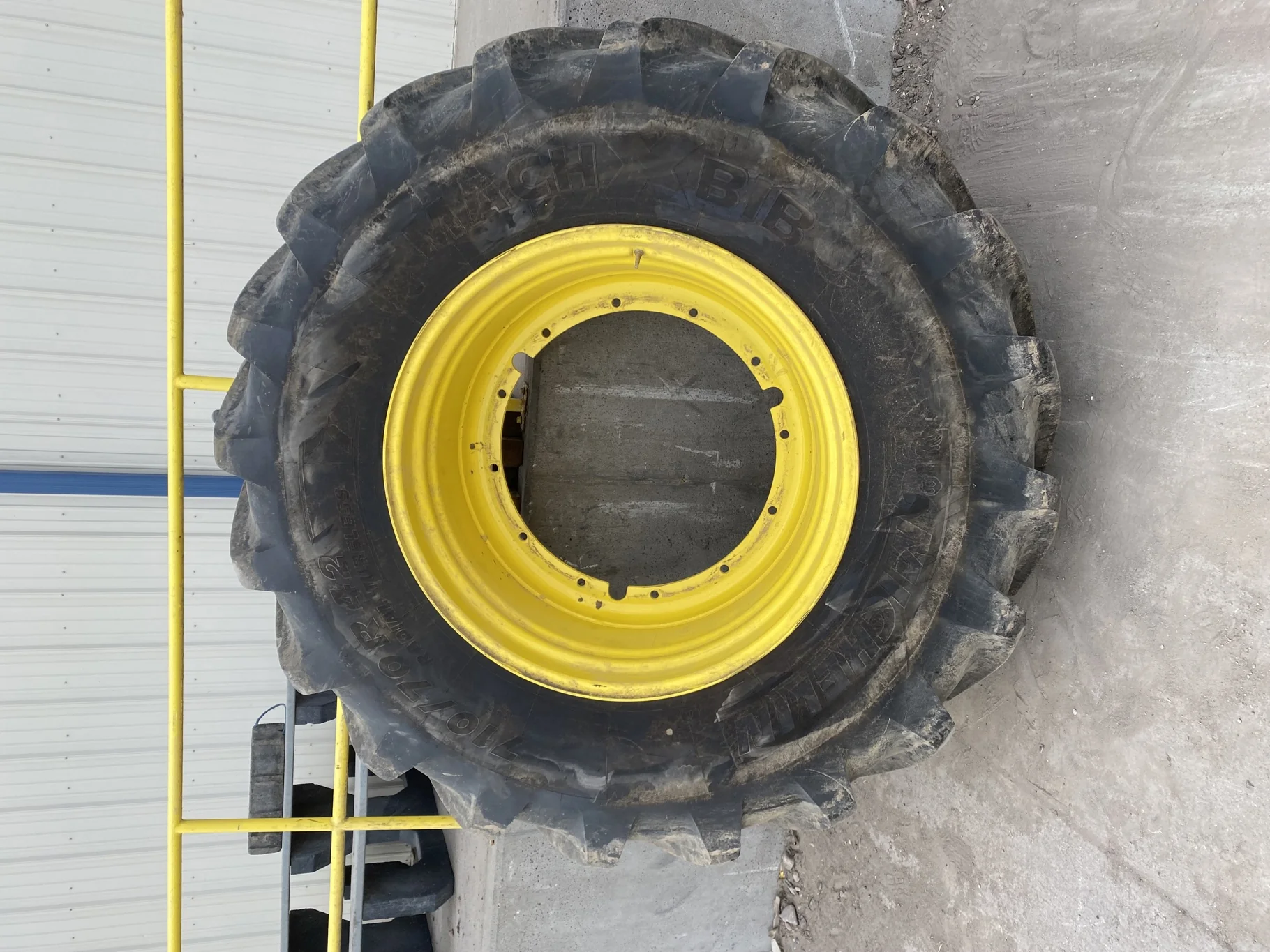 Used 98% 710/70R42 Michelin MachXBib R-1W 173D TL on a 23 x 42 JD Yellow 12 Bolt (.945) Stub D