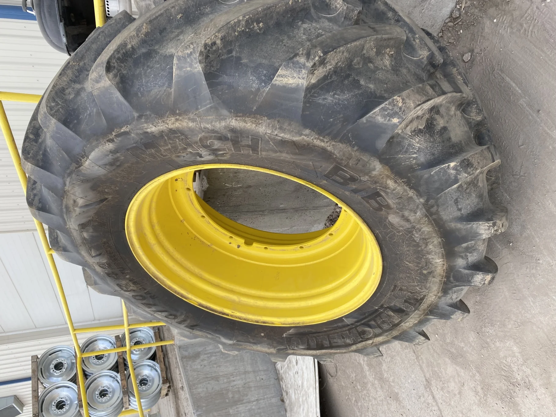 Used 98% 710/70R42 Michelin MachXBib R-1W 173D TL on a 23 x 42 JD Yellow 12 Bolt (.945) Stub D image 2