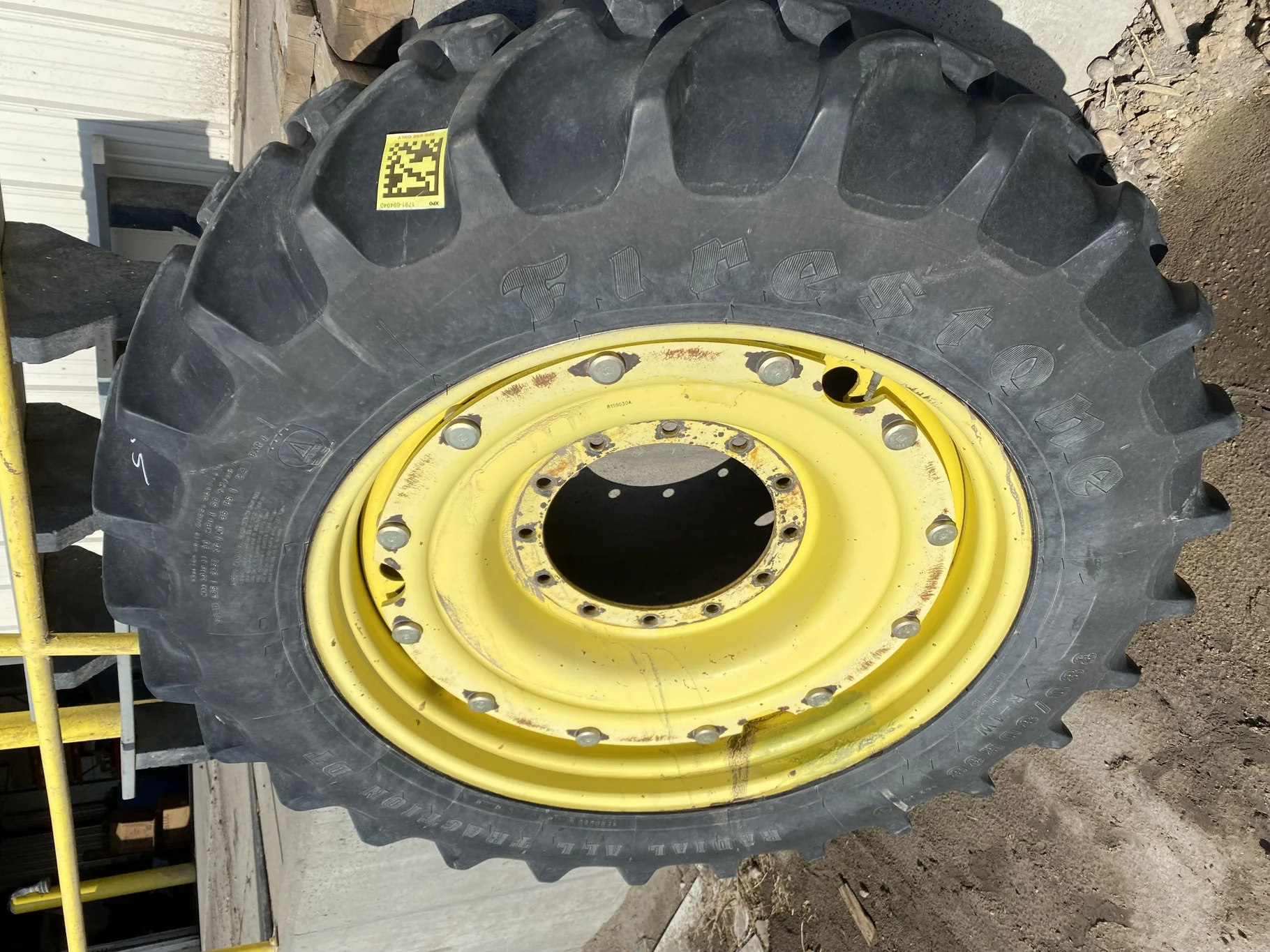Used 65% 380/80R38 Firestone Radial All Traction Deep Tread (142A8) R-1W TL on a 12 x 38 JD Ye