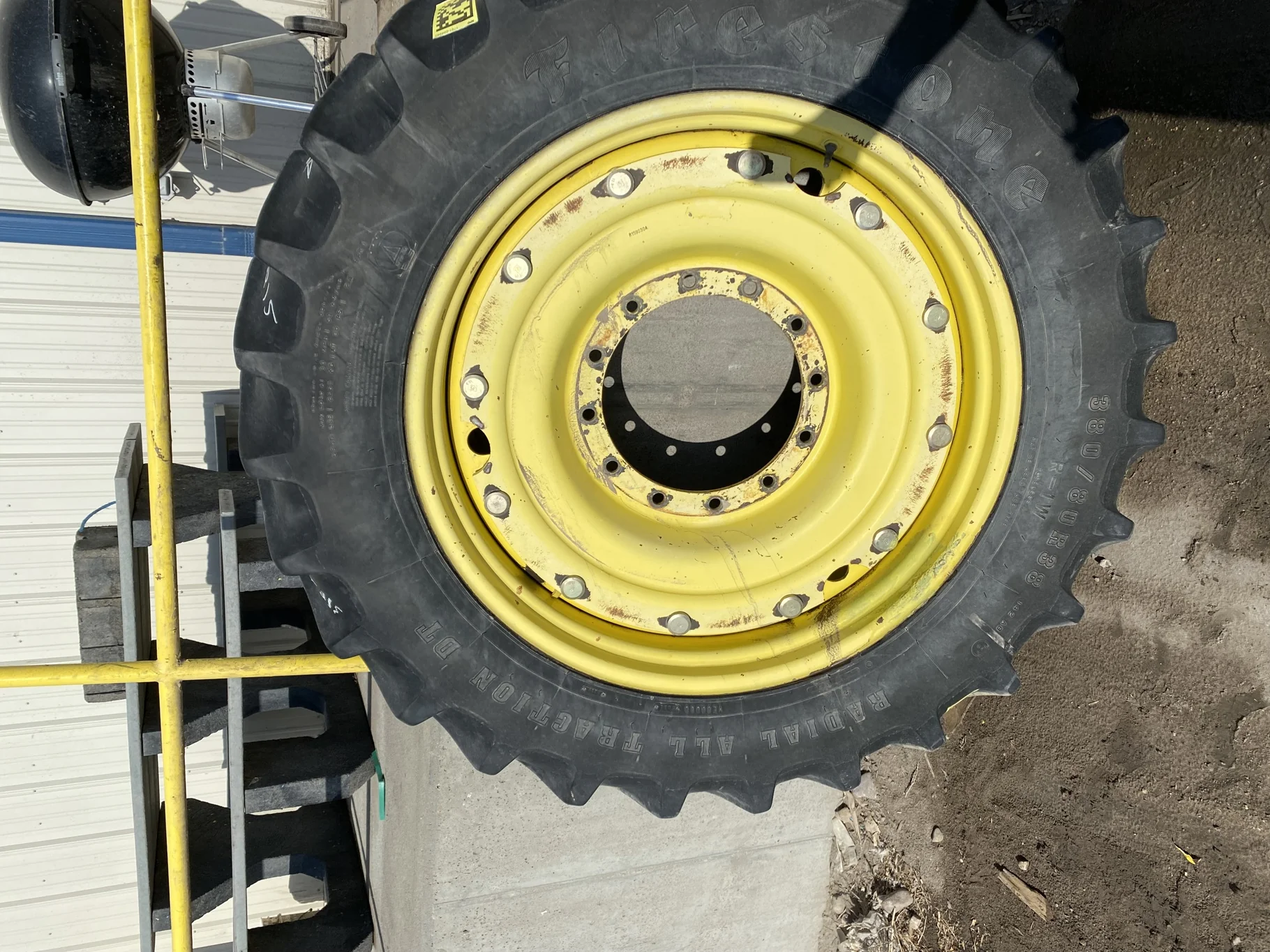 Used 65% 380/80R38 Firestone Radial All Traction Deep Tread (142A8) R-1W TL on a 12 x 38 JD Ye image 2