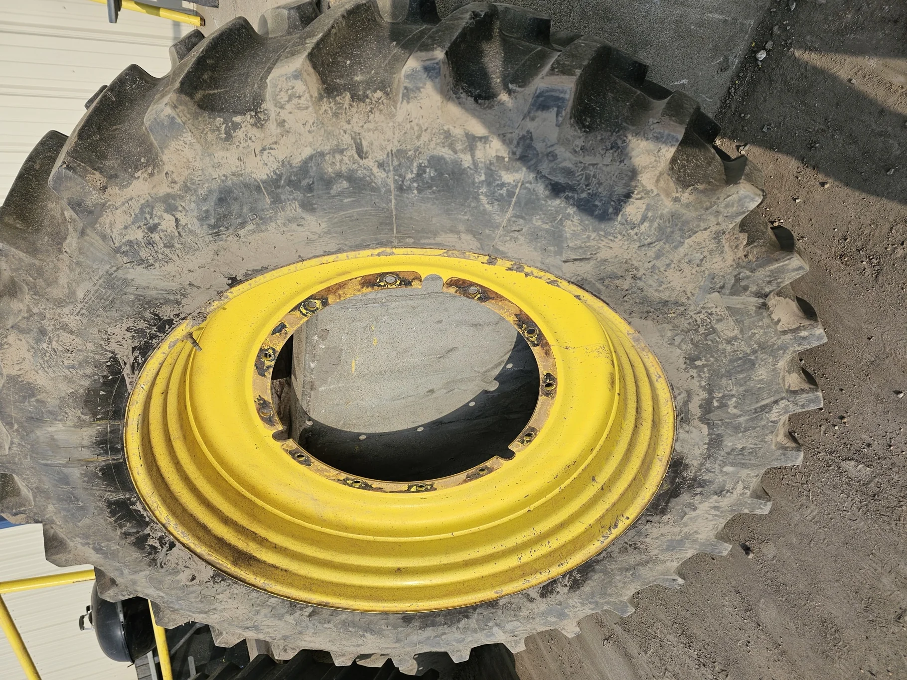 Used 75% 480/80R50 Firestone Radial Deep Tread 23 R-1W (159B) TL on a 15 x 50 JD Yellow 12 Bo