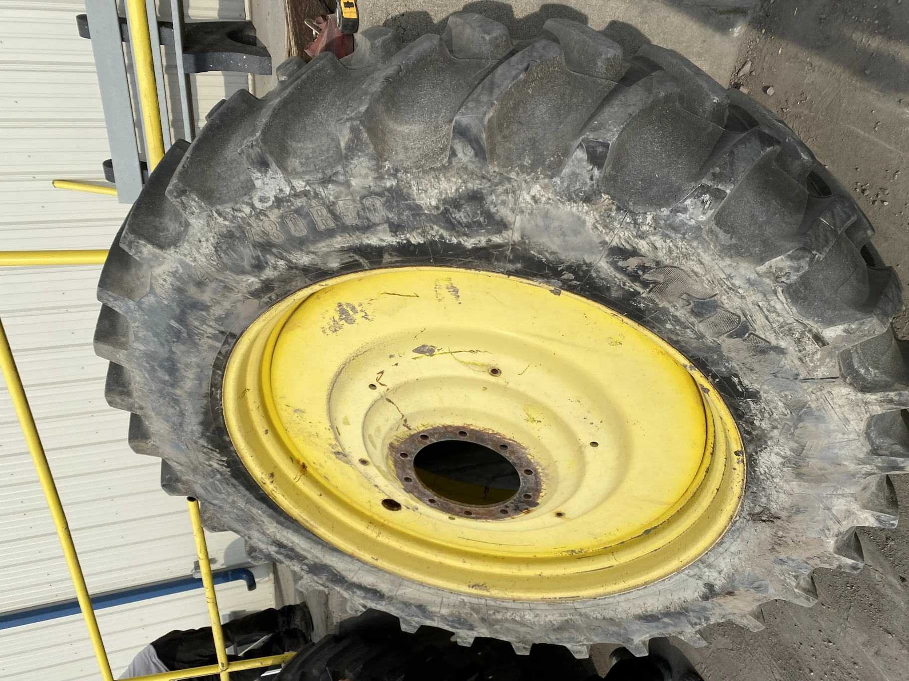 Used 80% 480/80R50 Firestone Radial Deep Tread 23 R-1W (159B) TL on a 15 x 50 JD Yellow 10 Bo