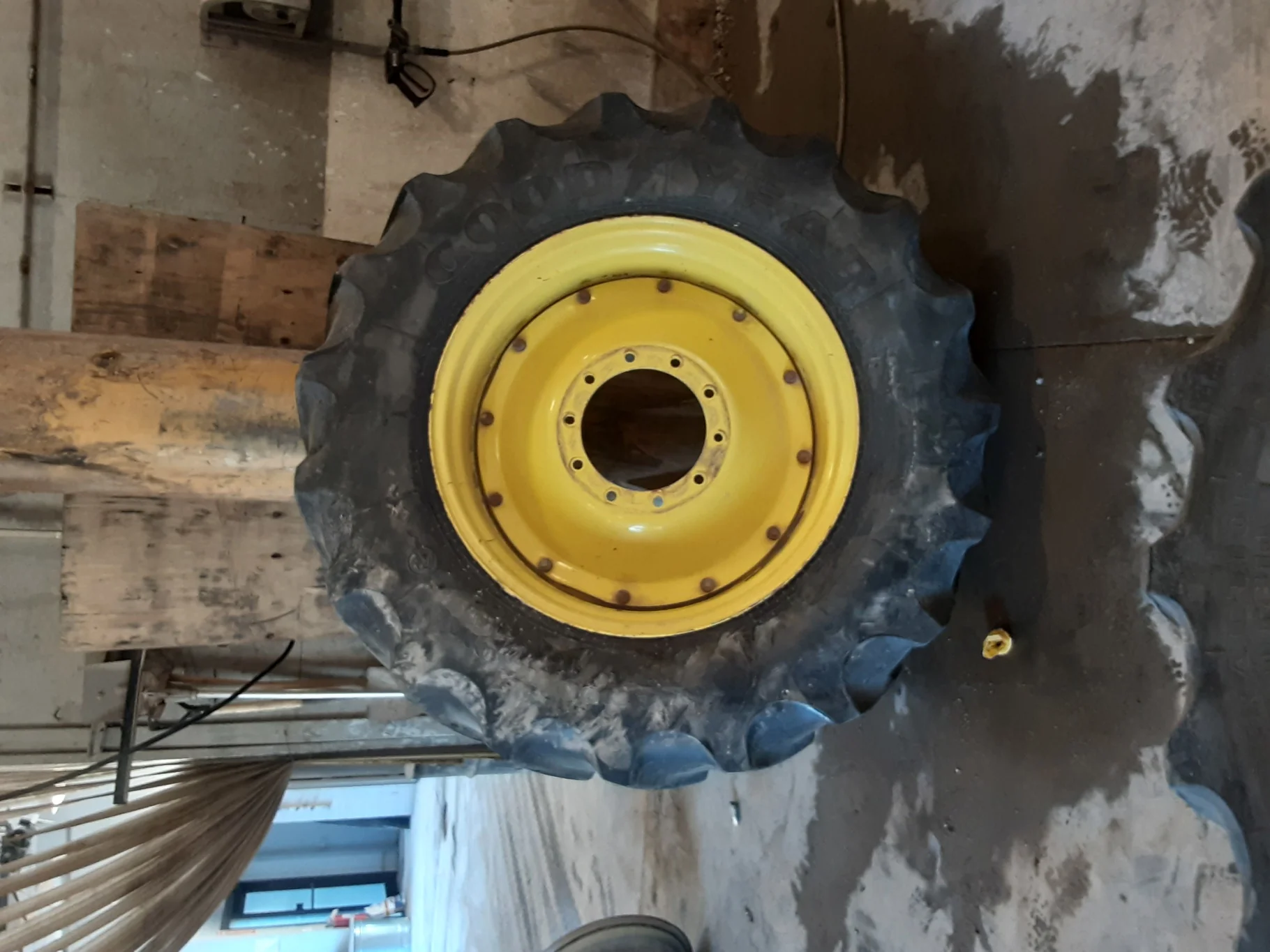 Used 60% 480/70R34 Goodyear Super Traction DT810 R-1W (155B) on a 15 x 34 JD Yellow Straight P