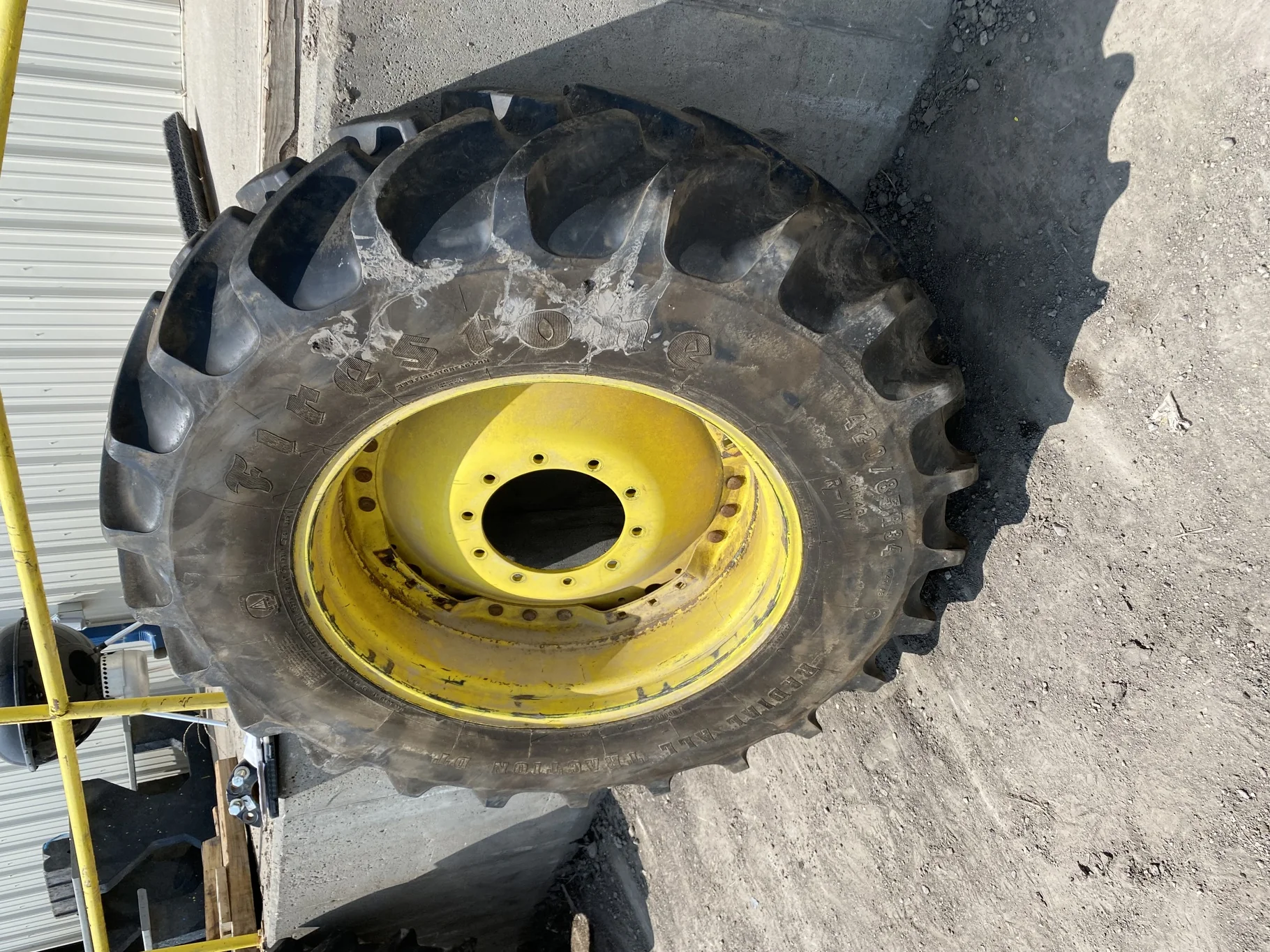 Used 85% 420/85R34 Firestone Radial All Traction DT R-1W 147A8 TL on a 13 x 34 JD Yellow Waffl