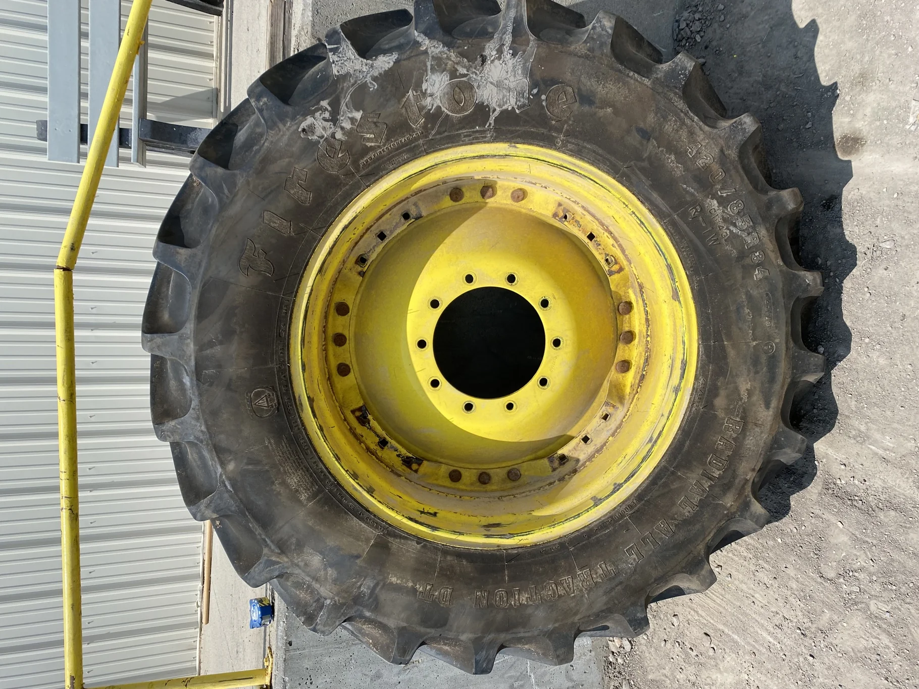 Used 85% 420/85R34 Firestone Radial All Traction DT R-1W 147A8 TL on a 13 x 34 JD Yellow Waffl image 2