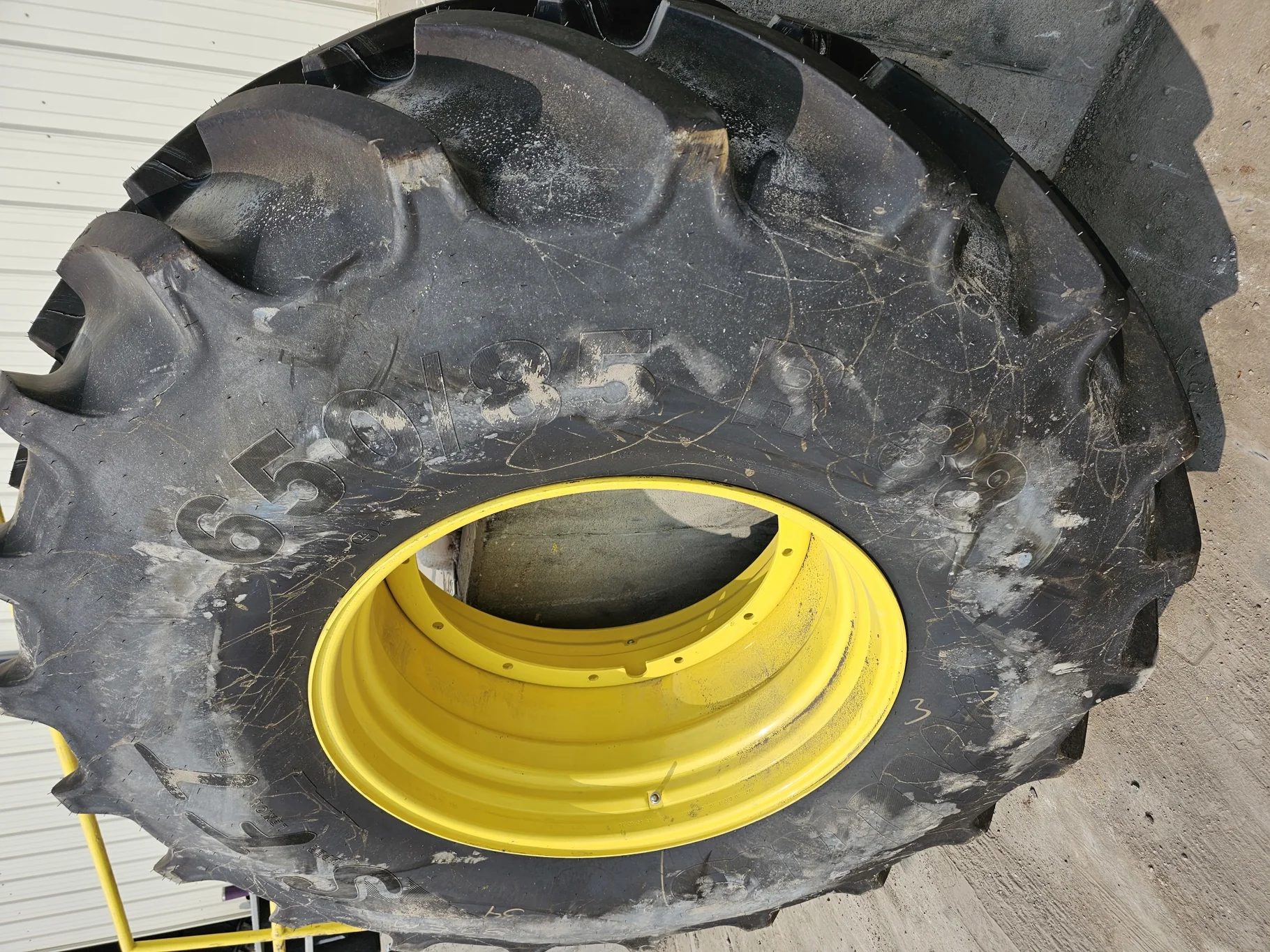USED 98% 650/85R38 Mitas SFT (173D/176A8) TL on a 23 X 38 JD Yellow 12 Bolt (.937) Stub Disc (