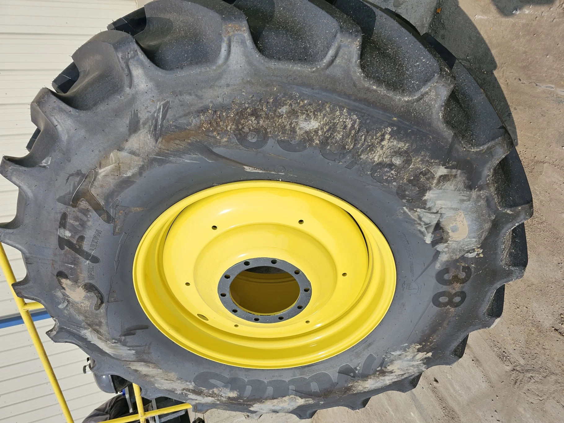 USED 98% 650/85R38 Mitas SFT (173D/176A8) TL on a 23 X 38 JD Yellow 10 Bolt (.937) 1/2" Formed