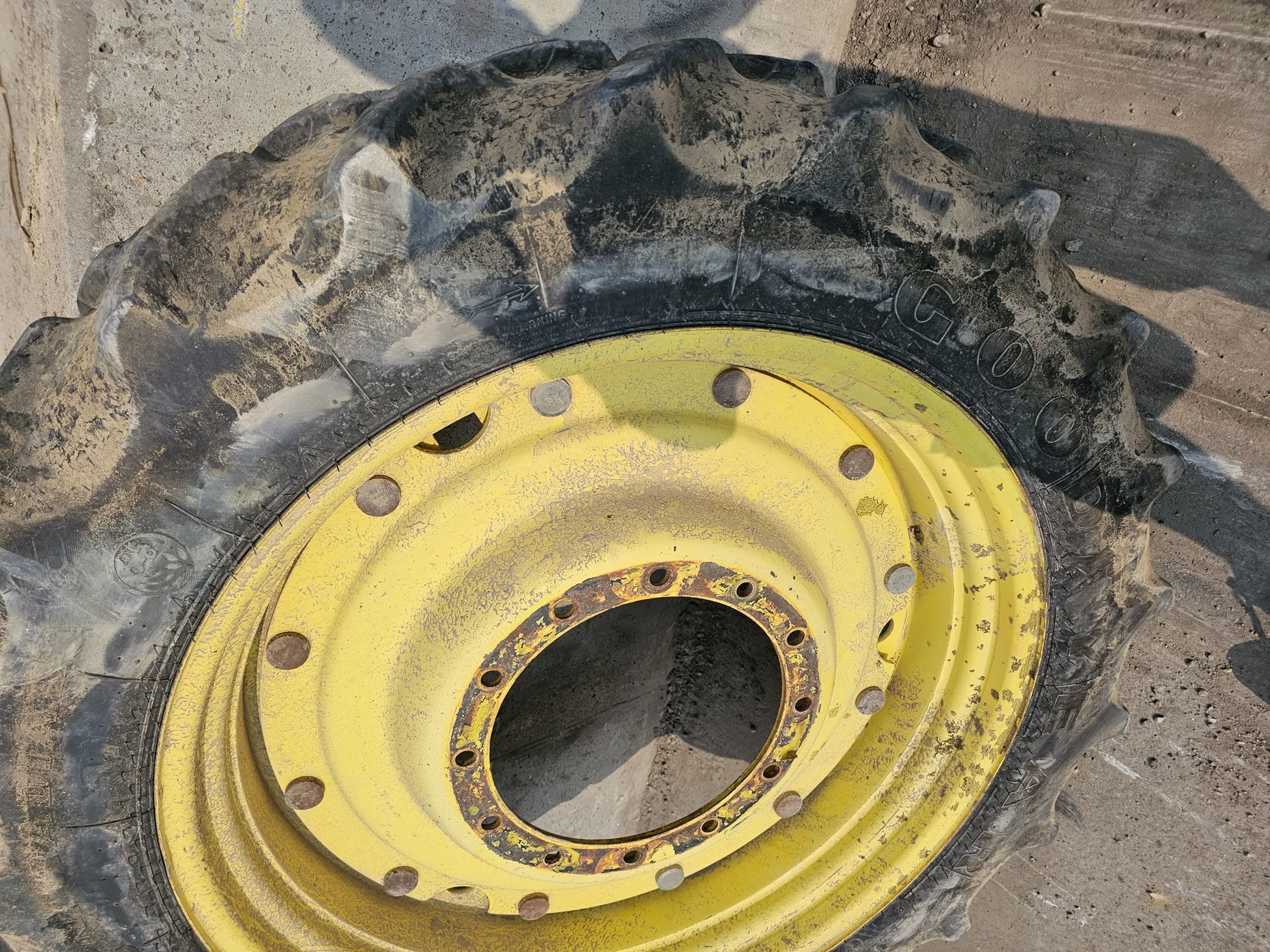 Used 45% 320/85R38 Goodyear Super Traction Radial  (142D) R-1W TL on a 10 x 38 John Deere Yellow St