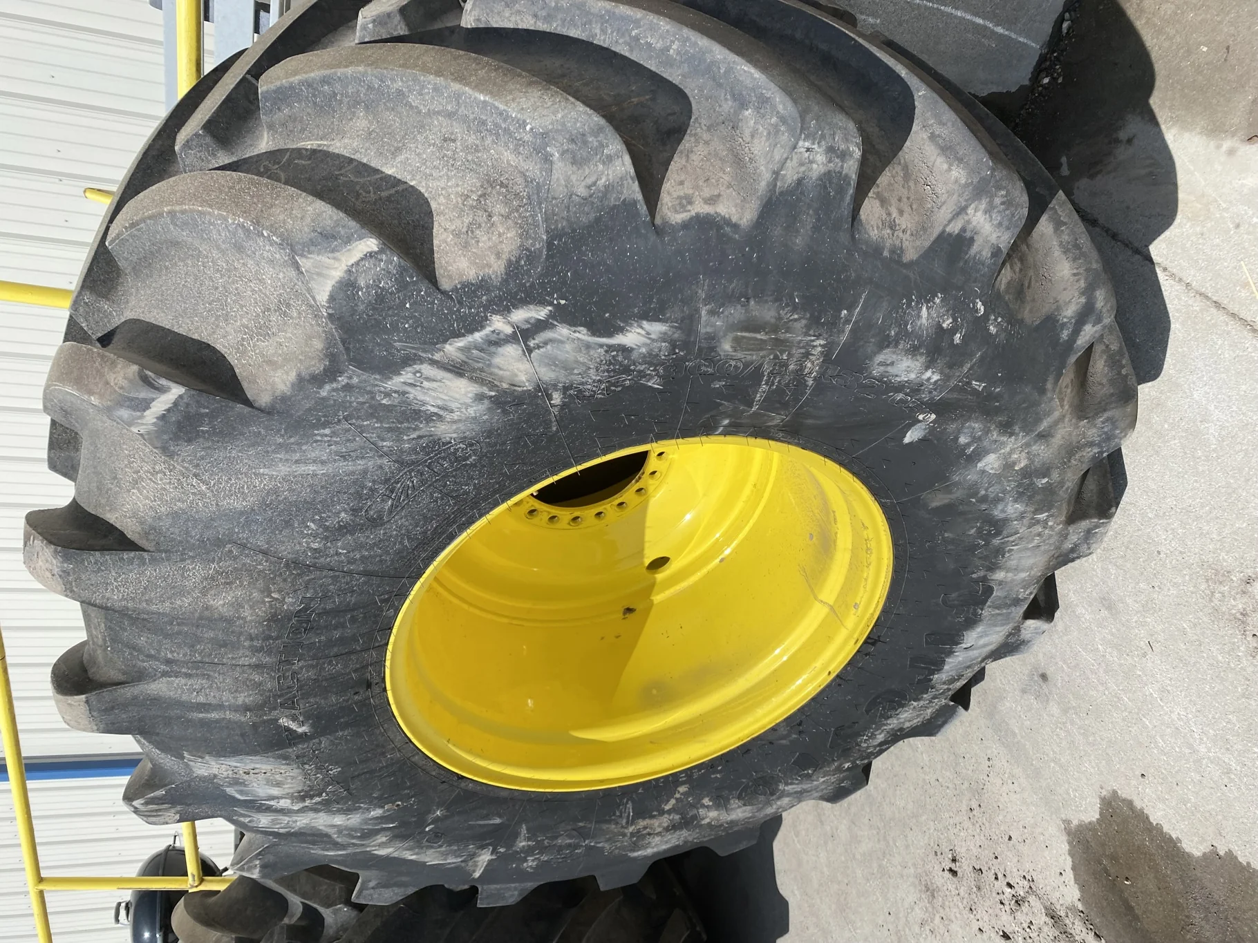 Used 90% VF900/60R32 CFO Firestone Maxi Traction R-1W 193B TL on a 30 x 32 JD 20 Bolt Combine Drive