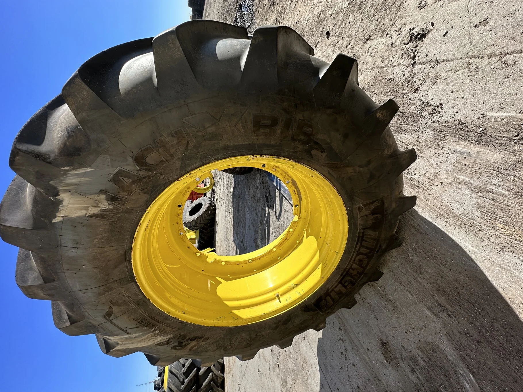Used 80% 710/70R42 Michelin MachXBib R-1W 173D TL on a 23 x 42 JD Yellow 12 Bolt (.945) Stub D
