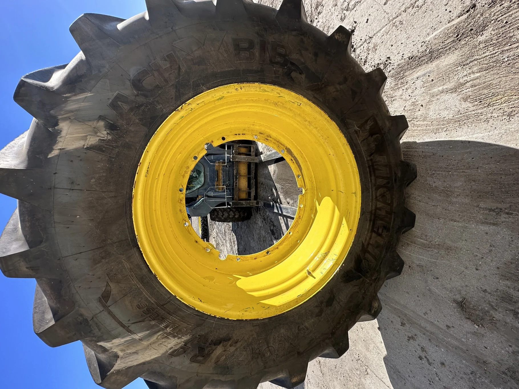 Used 80% 710/70R42 Michelin MachXBib R-1W 173D TL on a 23 x 42 JD Yellow 12 Bolt (.945) Stub D image 2