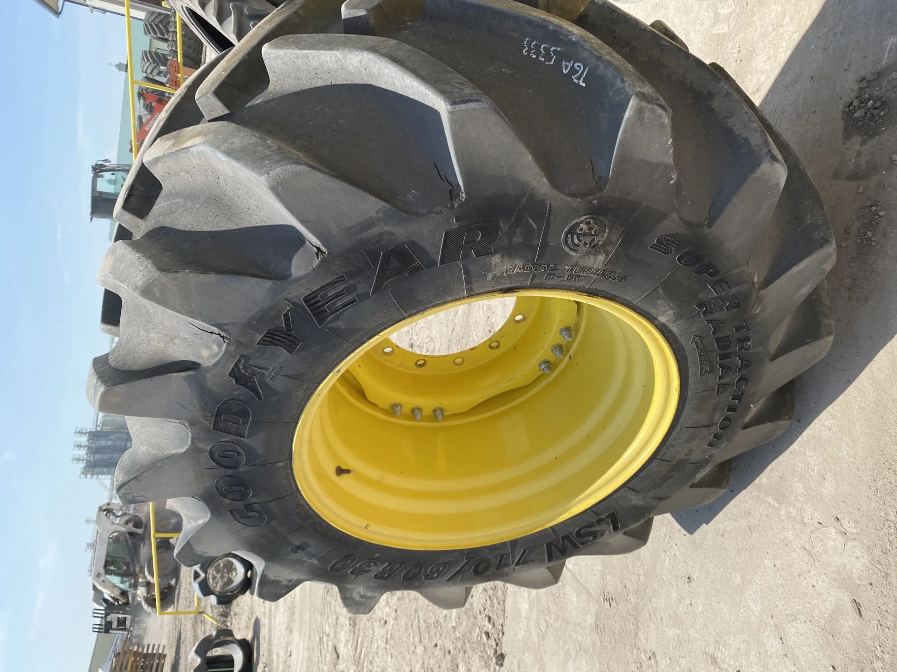 Used 85% LSW 710/60R30 Goodyear Super Traction Radial (177D) mounted on 25 x 30 JD Yellow 12 B