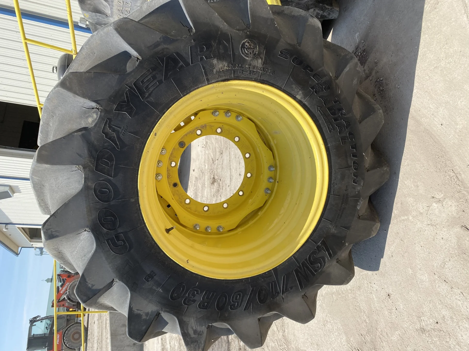 Used 85% LSW 710/60R30 Goodyear Super Traction Radial (177D) mounted on 25 x 30 JD Yellow 12 B image 2