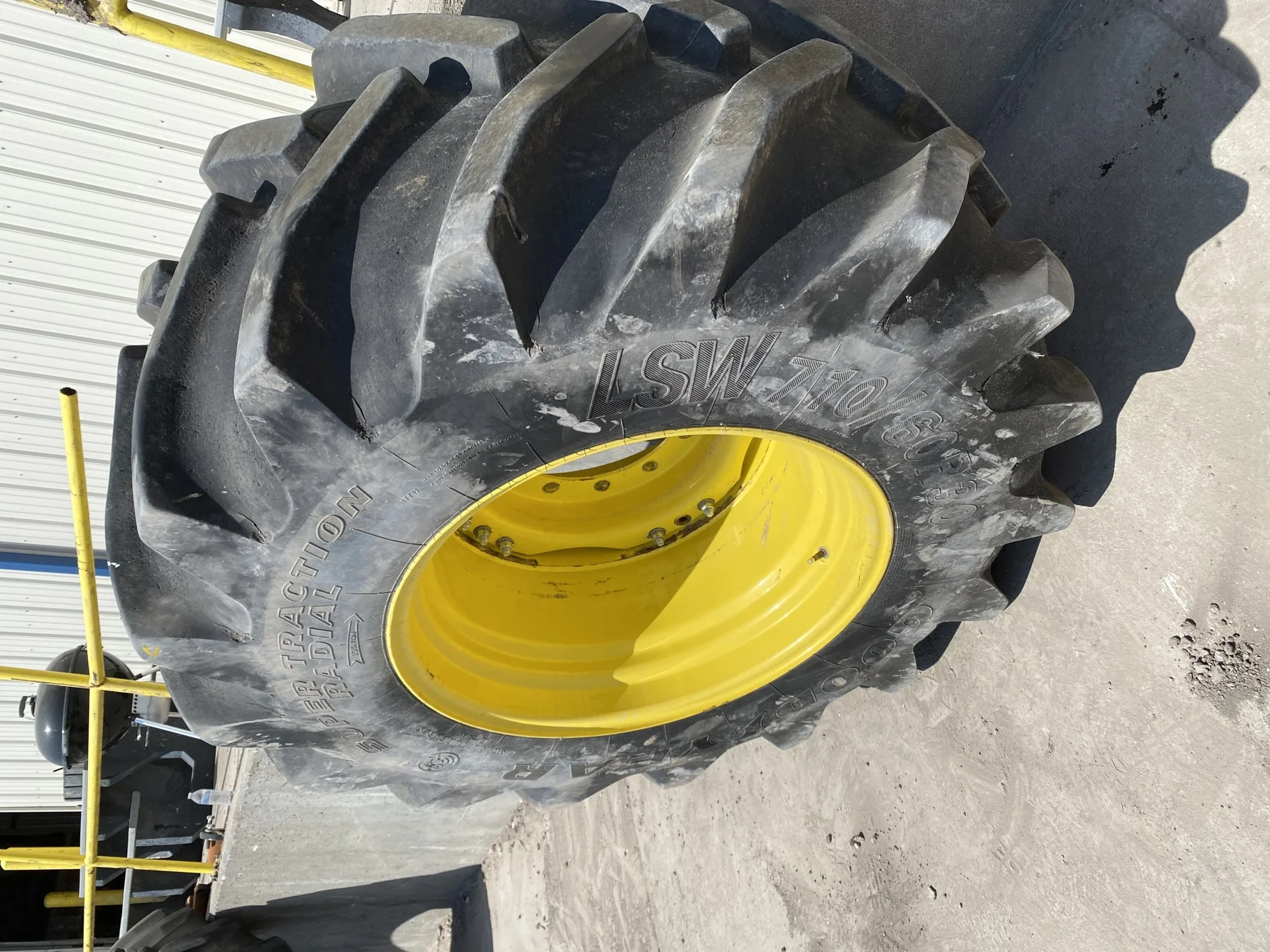 Used 85% LSW 710/60R30 Goodyear Super Traction Radial (177D) mounted on 25 x 30 JD Yellow 12 B