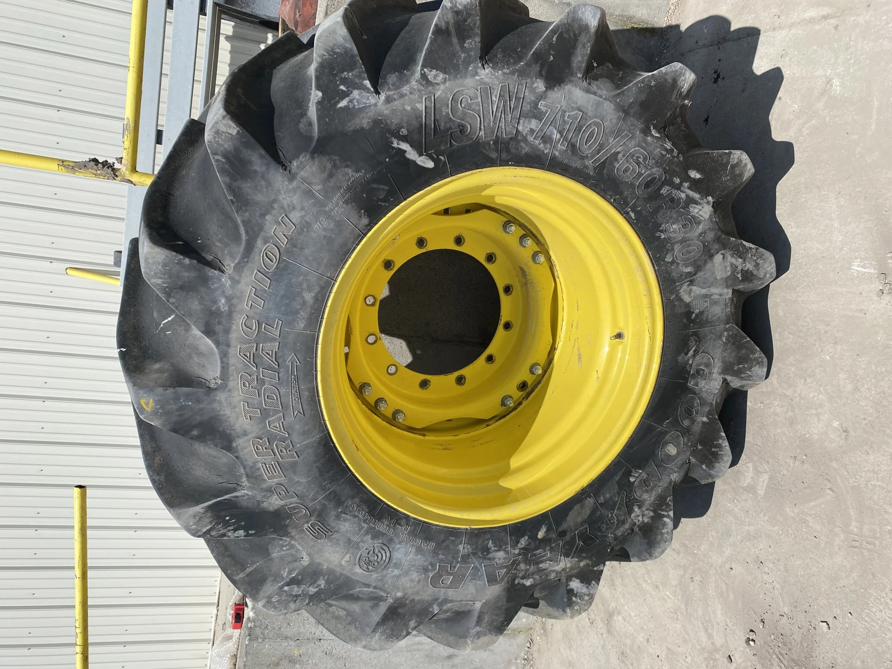 Used 85% LSW 710/60R30 Goodyear Super Traction Radial (177D) mounted on 25 x 30 JD Yellow 12 B image 2