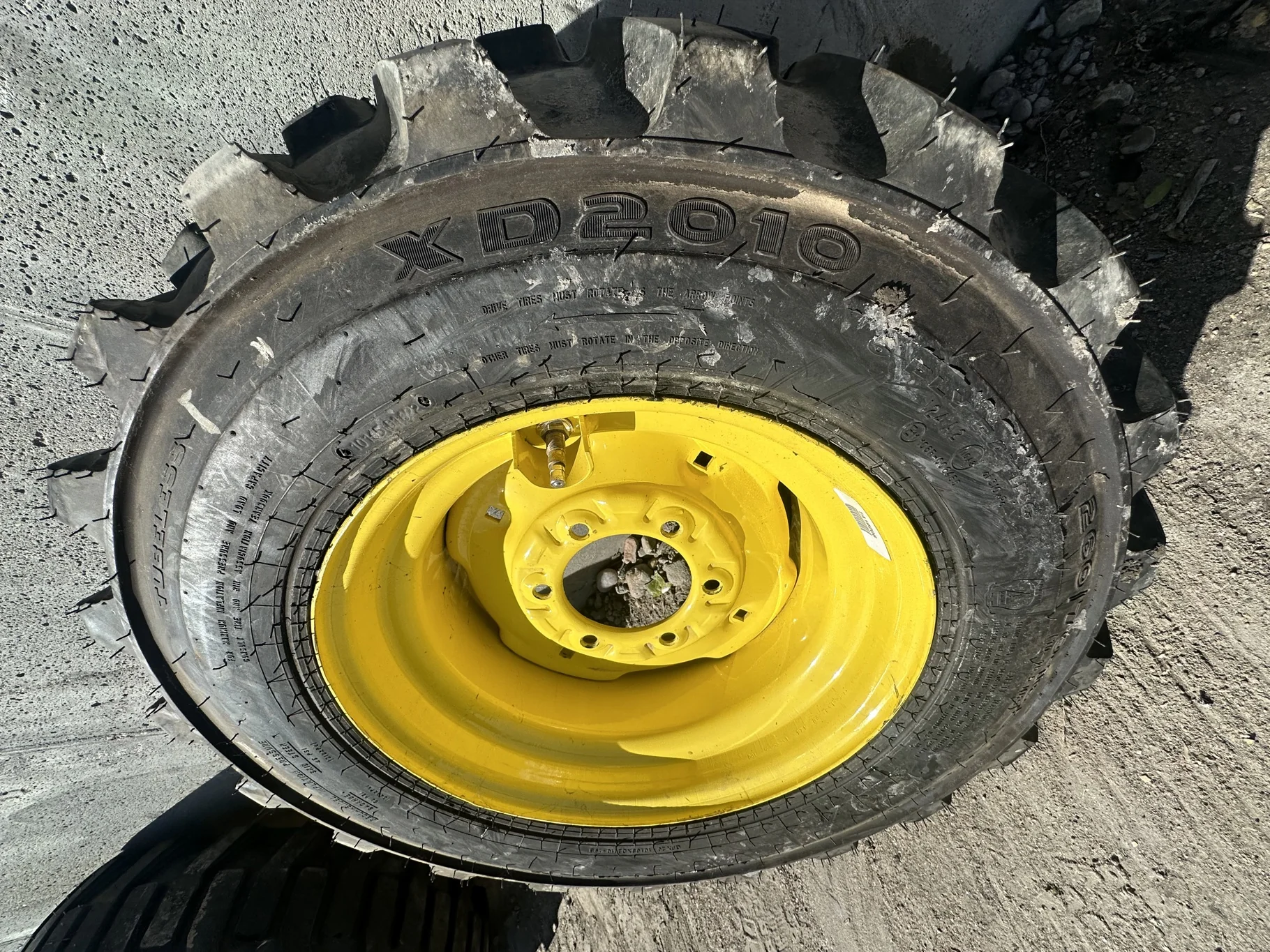 Take Off 10-16.5 NHS Galaxy XD2010 (6Ply) TL on a 8.25 X 16.5 JD Yellow 6 Bolt Implement Wheel