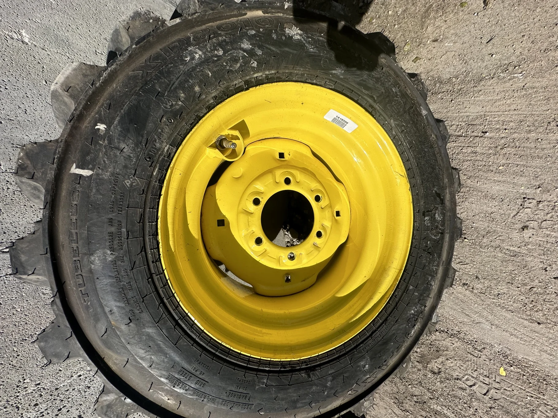 Take Off 10-16.5 NHS Galaxy XD2010 (6Ply) TL on a 8.25 X 16.5 JD Yellow 6 Bolt Implement Wheel image 2